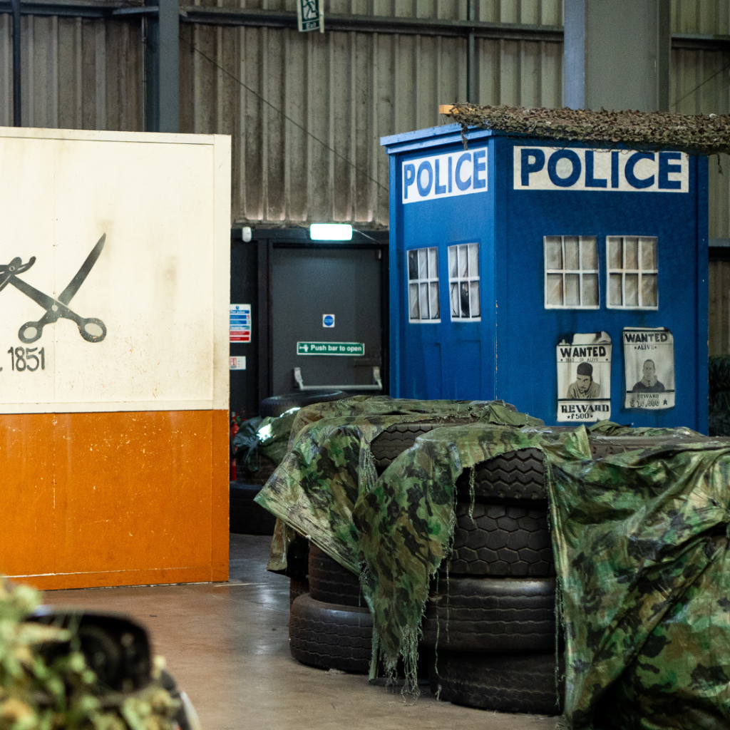 Immersive laser tag arena at Laser Combat Dundee with Dundee-themed cityscape